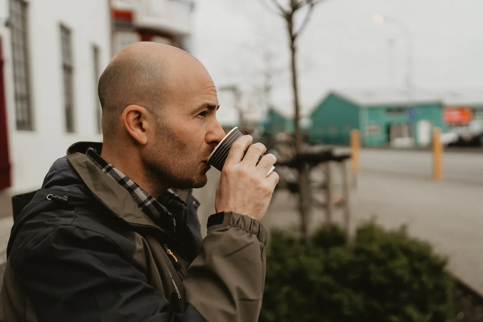Dan sipping coffee outdoors