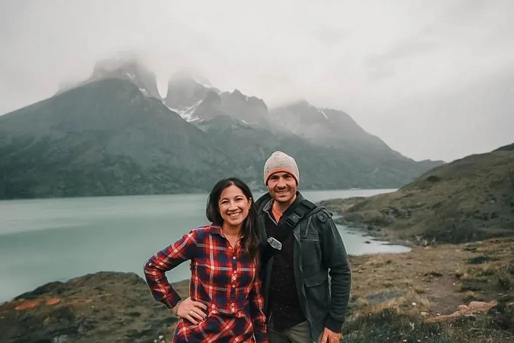 Dan and Lydia in front of jagged mountain peaks